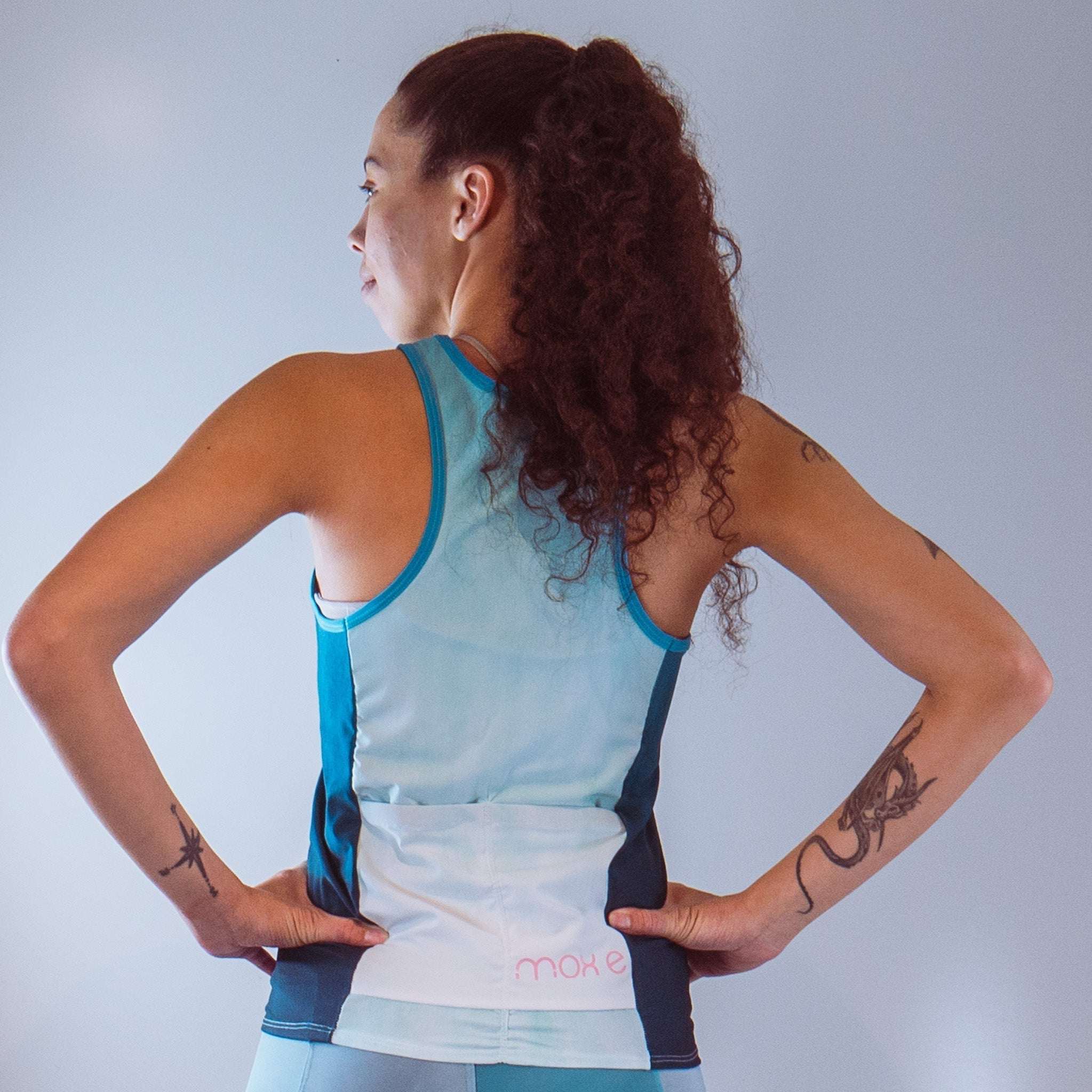 Women's sleeveless bike jersey in forest design, breathable mesh fabric, ideal for cycling.